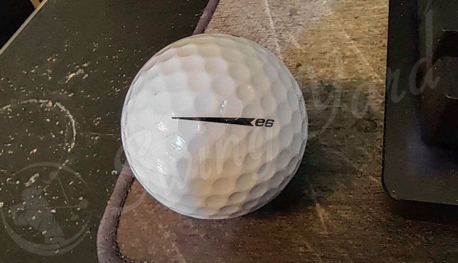A Bridgestone e6 ball in the floor at the golf simulation room