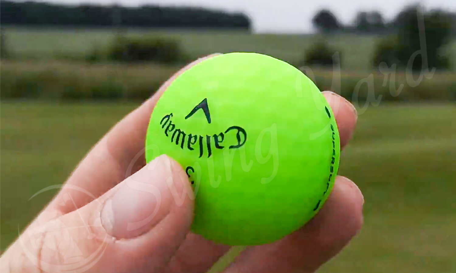 A green matte Supersoft ball in my hand for testing