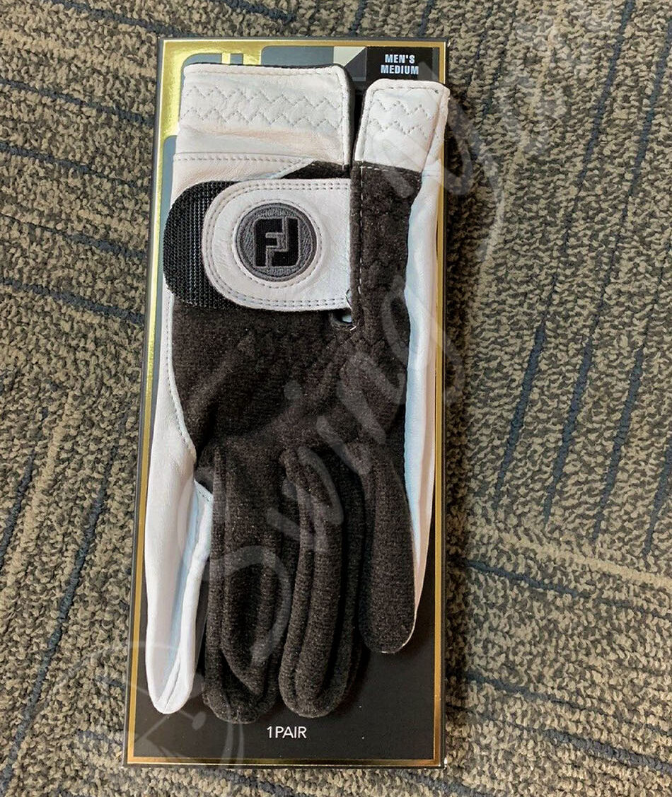 A new FootJoy StaSof winter golf gloves on the floor