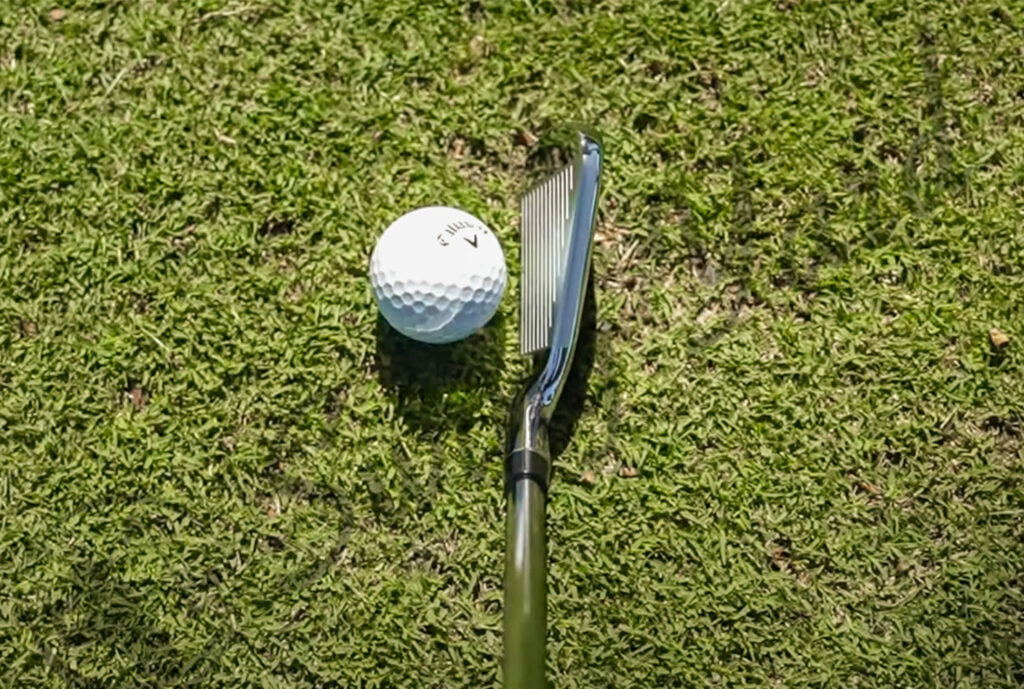 Me hitting a golf ball using Callaway Paradym X iron