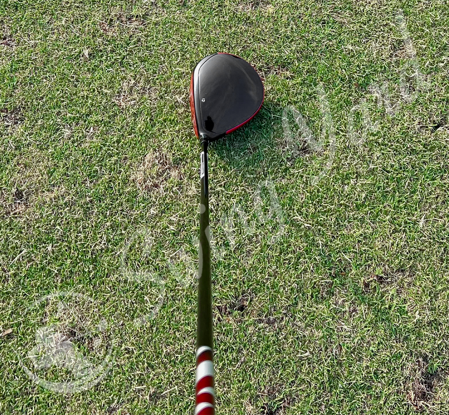 Showing the crown part of TaylorMade Stealth 2 driver in the grass
