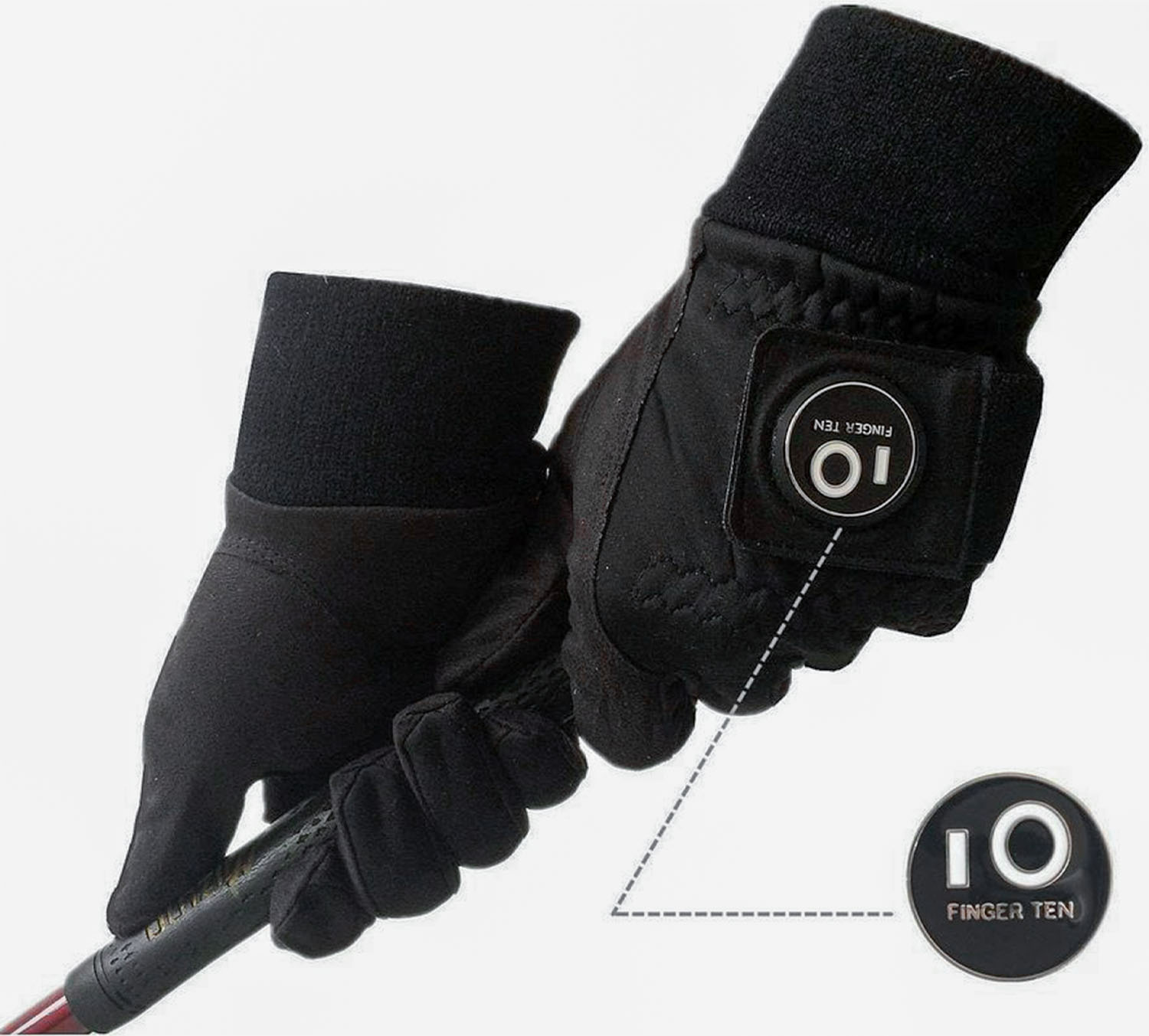 A Finger Ten winter golf gloves holding a golf club handle