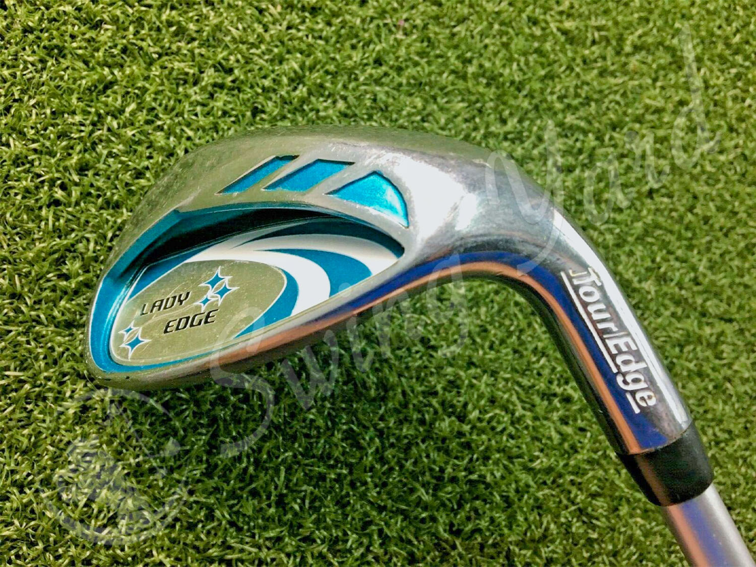 The Tour Edge Lady Edge Iron in the grass for testing at the golf course