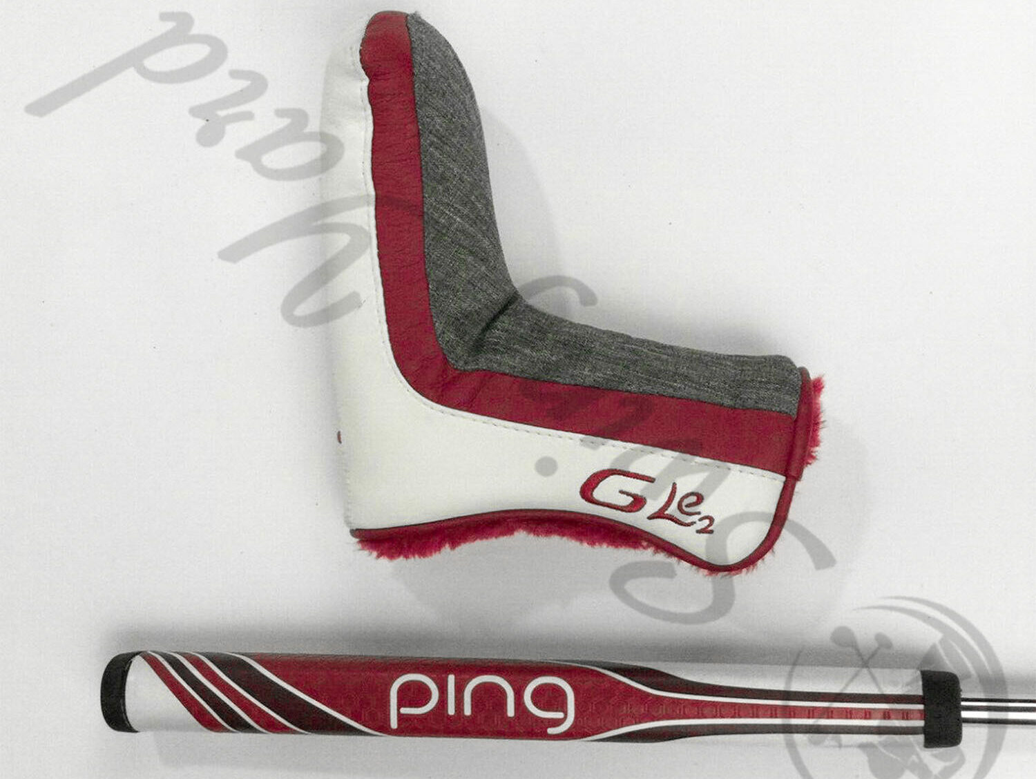 A Ping GLE 2 Shea Putter PP59 midsize grip and headcover in the floor