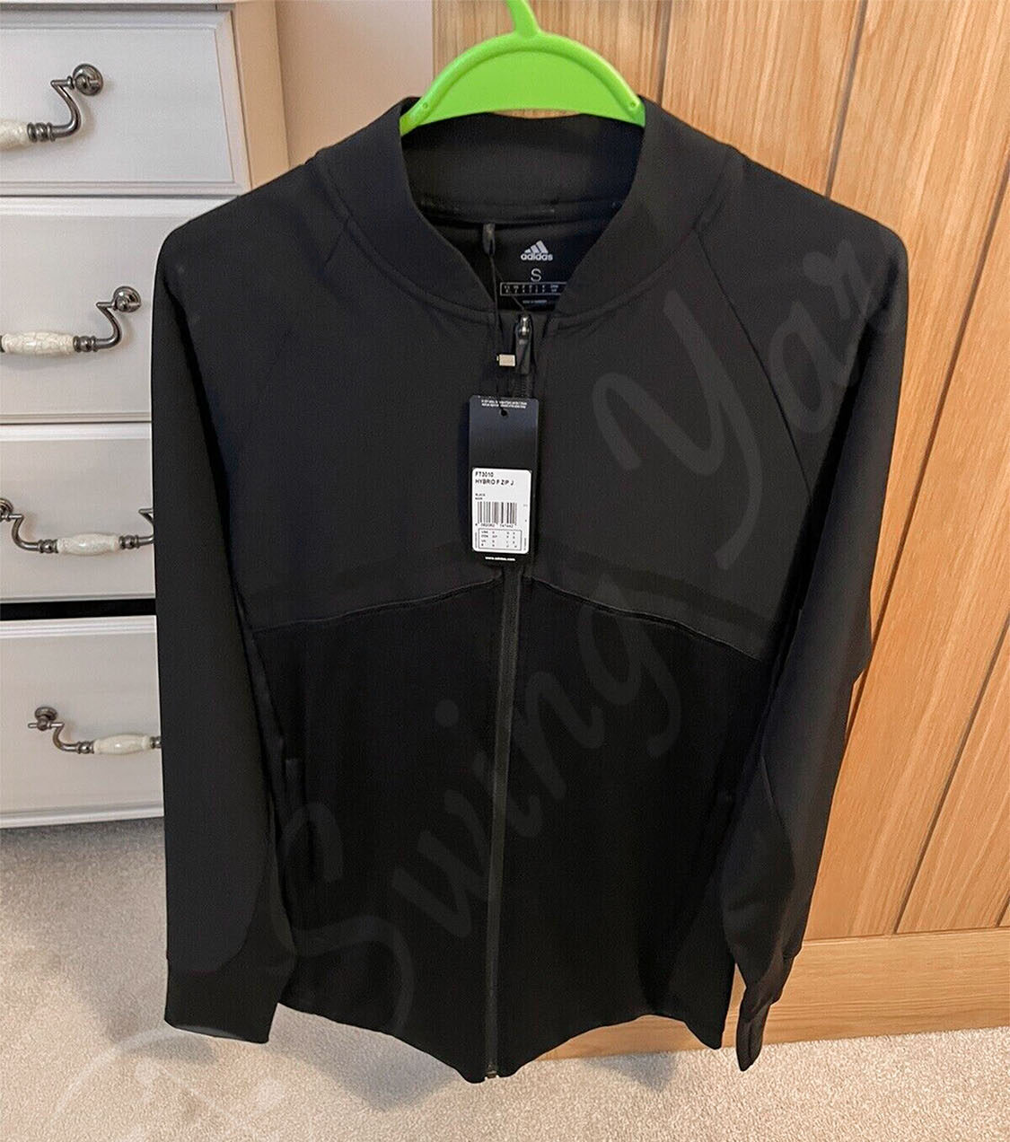 My new Adidas Men’s Hybrid Golf Winter Jacket hanging in my room