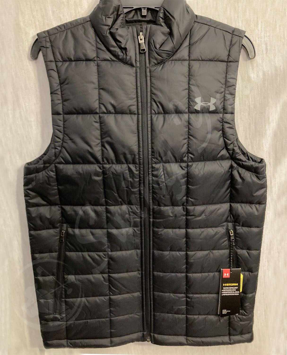 A new black Under Armour coldgear reactor cold weather golf vest for winter