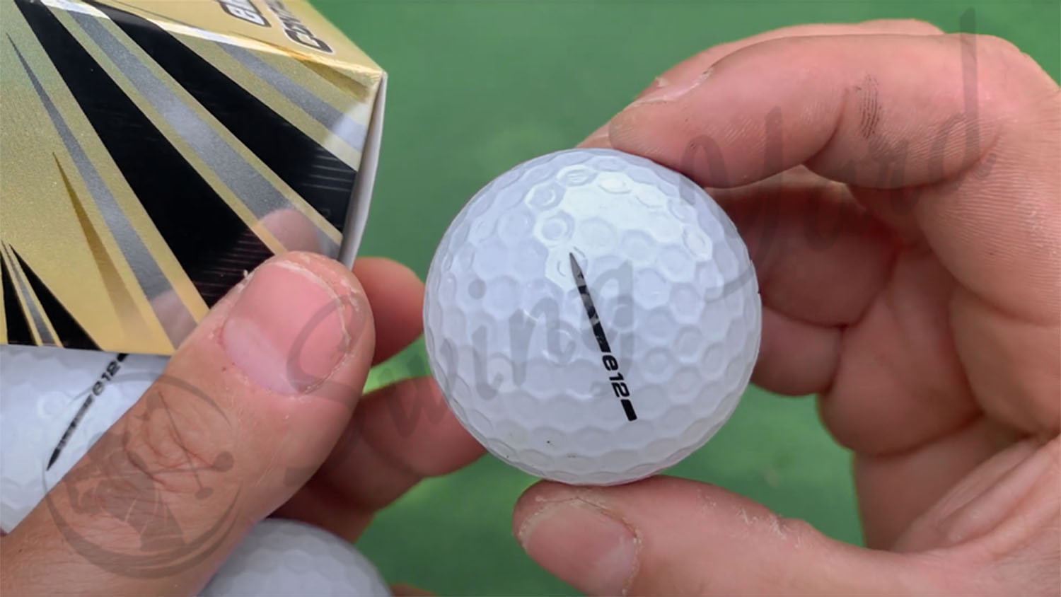 Me holding Bridgestone e12 Contact golf ball for testing at the golf course