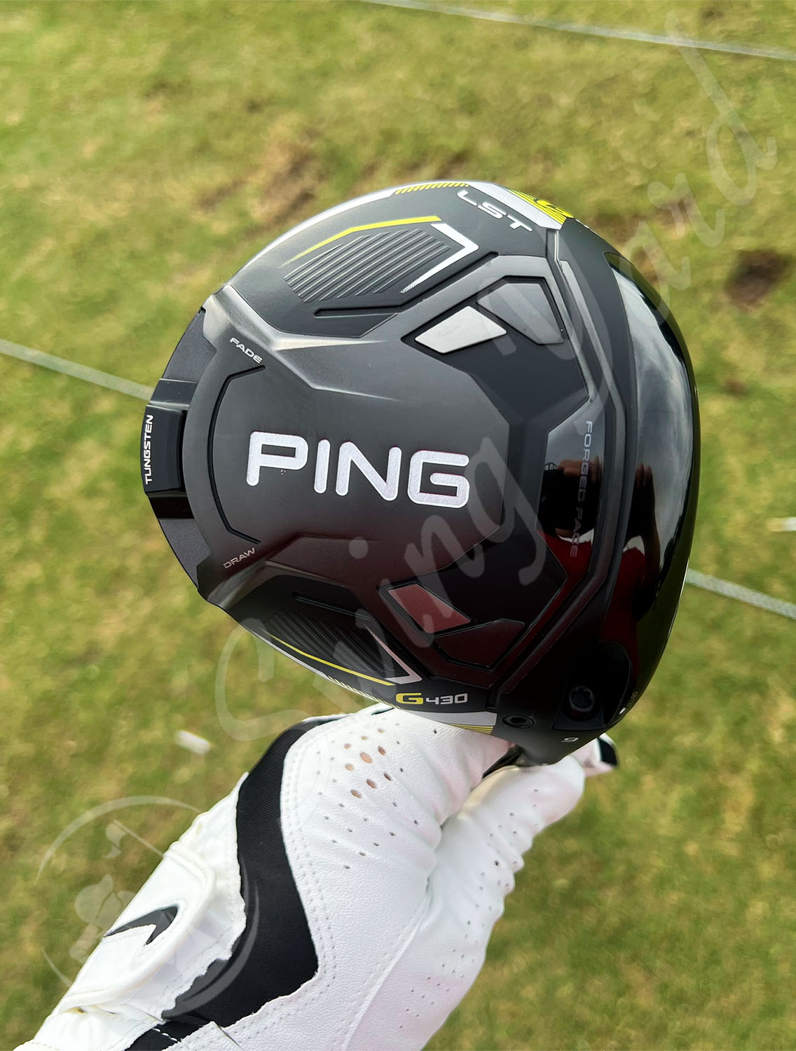Me holding a new Ping G430 LST Driver for testing at the golf course