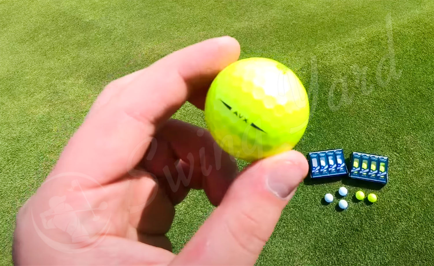 Me holding the yellow Titleist AVX golf ball at the golf course