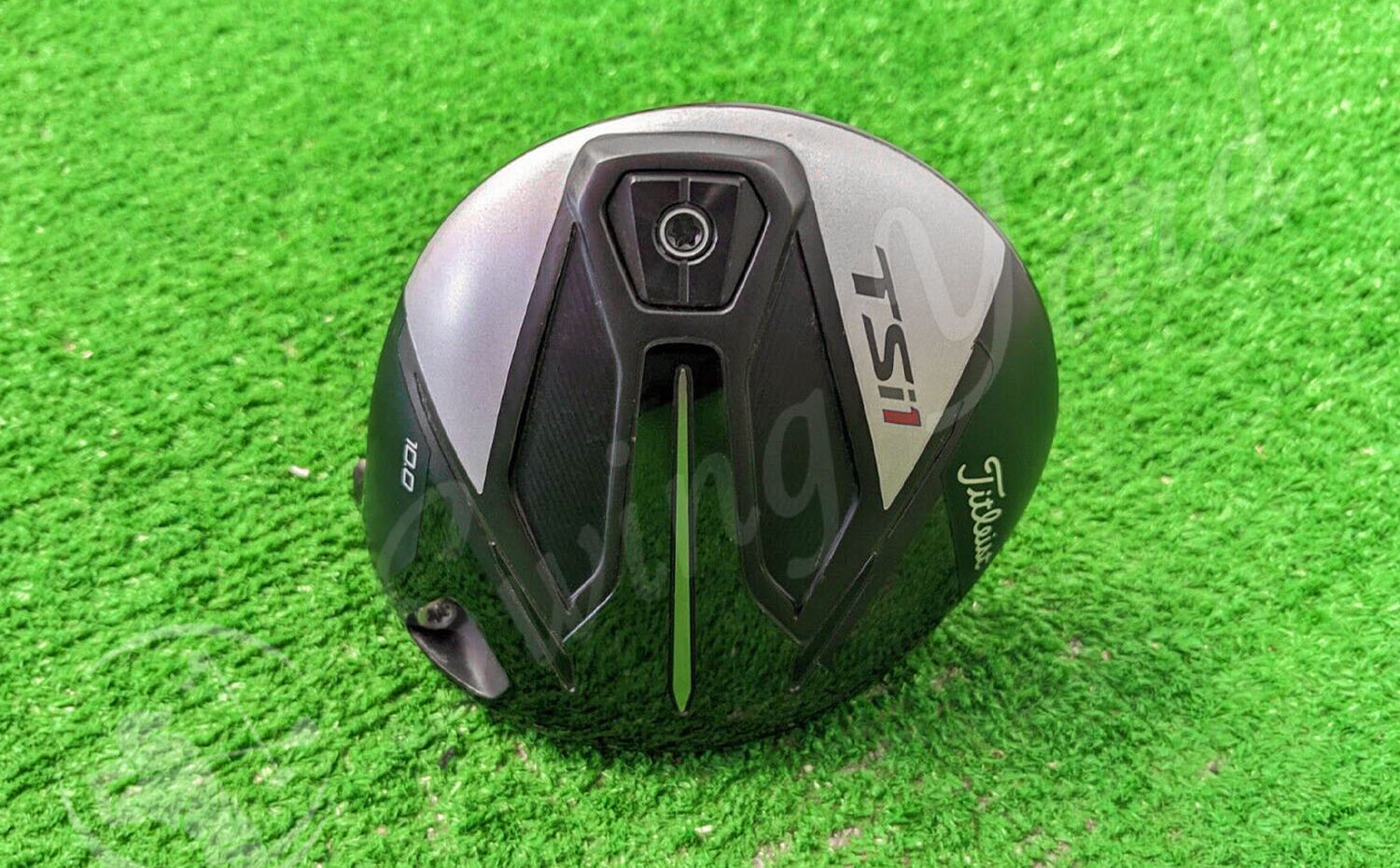 A Titleist TSi1 Driver clubhead in the grass for testing