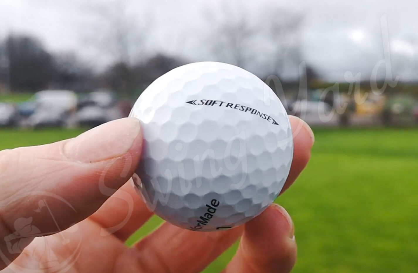 A TaylorMade Soft Response ball in my hand at the golf course