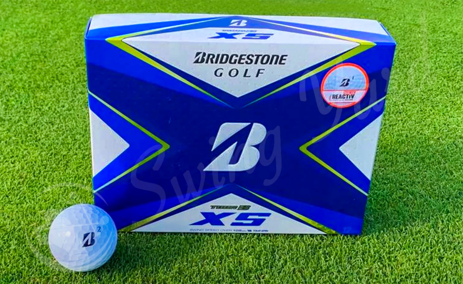 A frontside view of Bridgestone Tour B XS box in the grass at the golf course