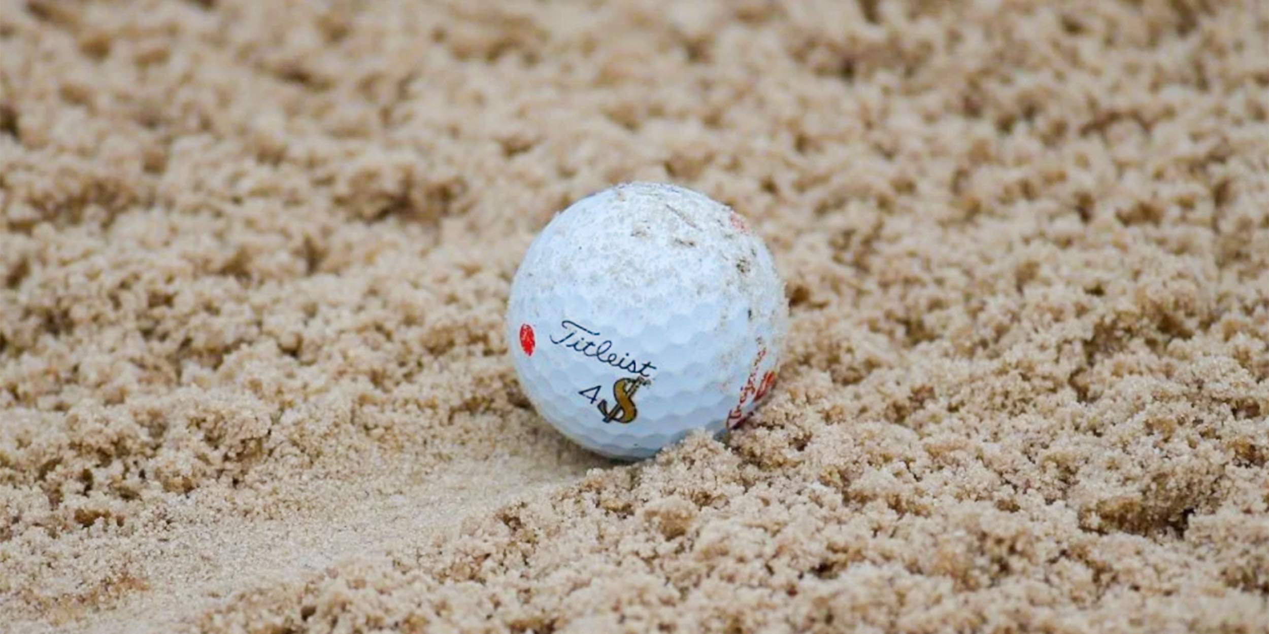 Golf ball getting scuffed by sand