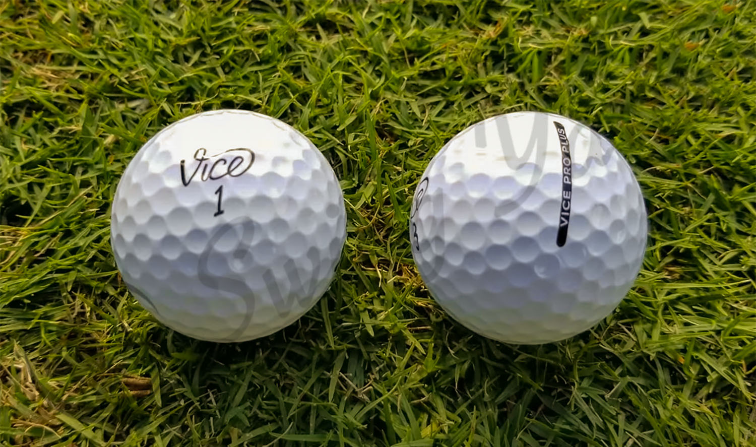 A Vice Pro Plus balls in the grass at the golf course