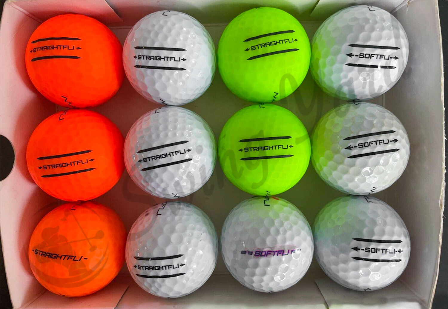 The Maxfli StraightFli golf balls inside the box