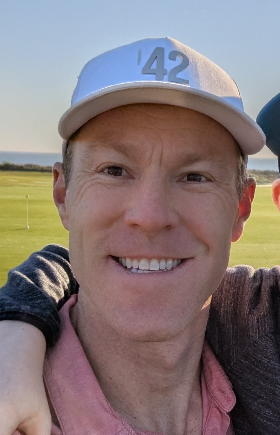 Brian Bomgren with Swing Yard smiling confidently on the golf course before a round