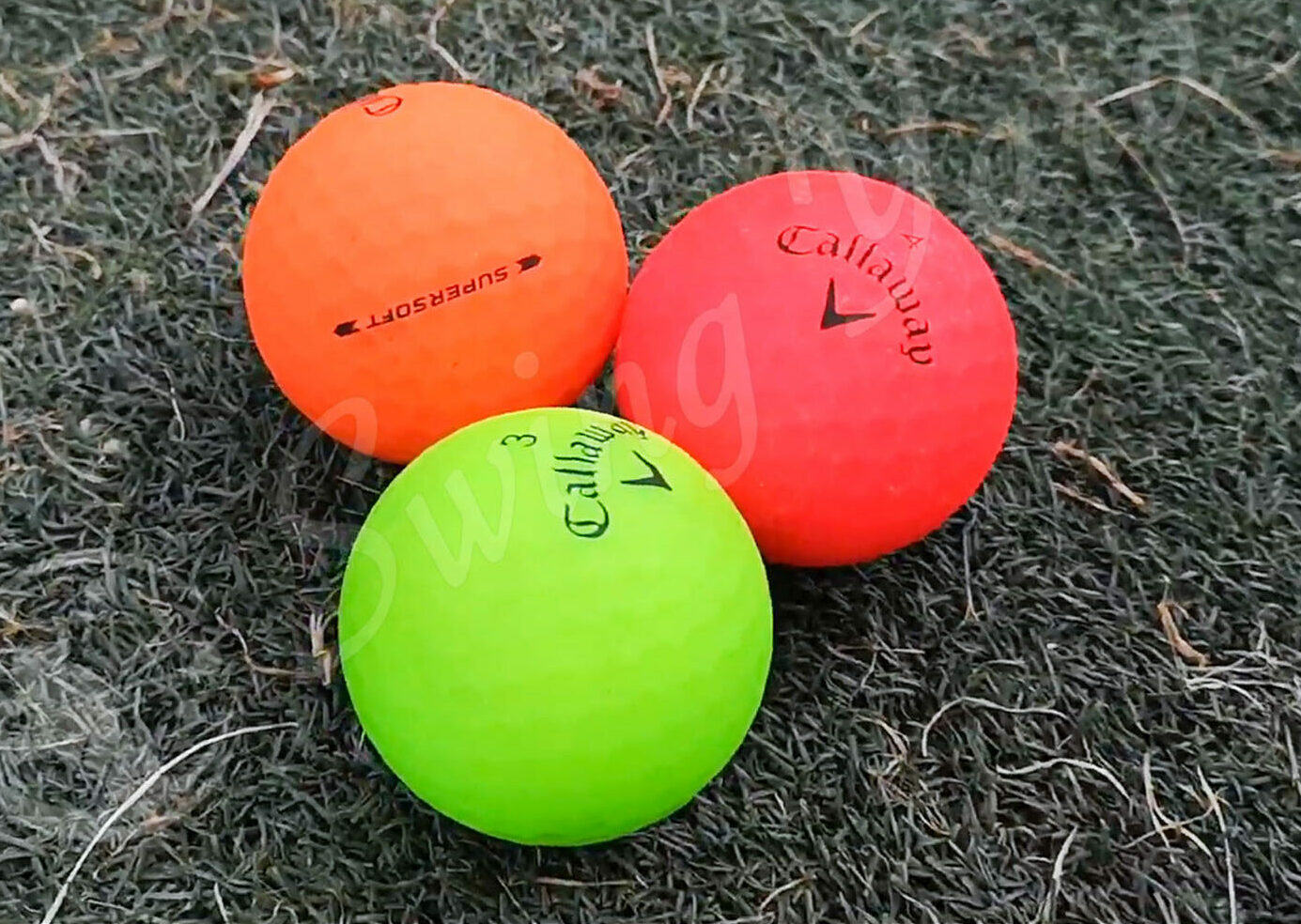 The set of Callaway Supersoft balls in the grass at the golf course