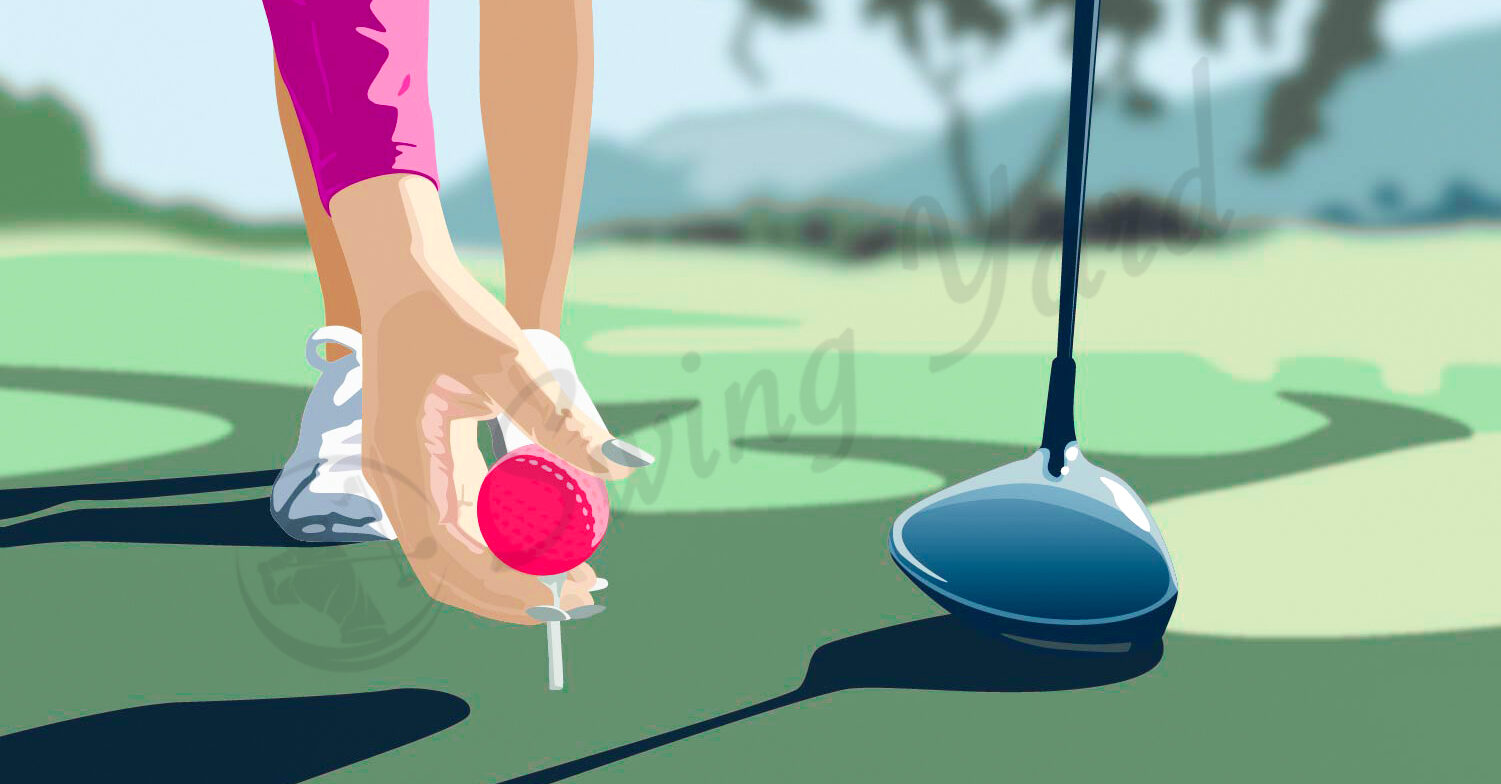 A female golfer teeing up a ball