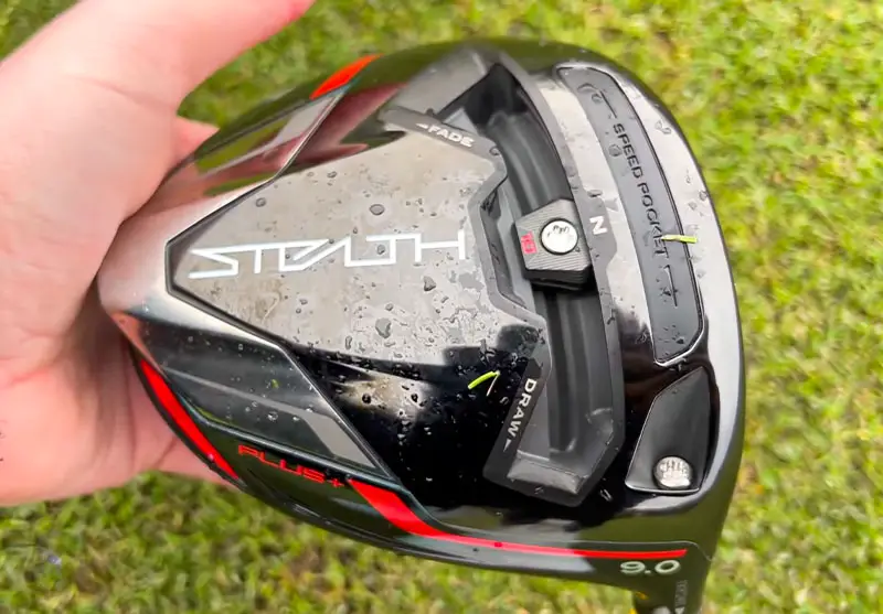 Man holding the Stealth Plus Driver in his hand