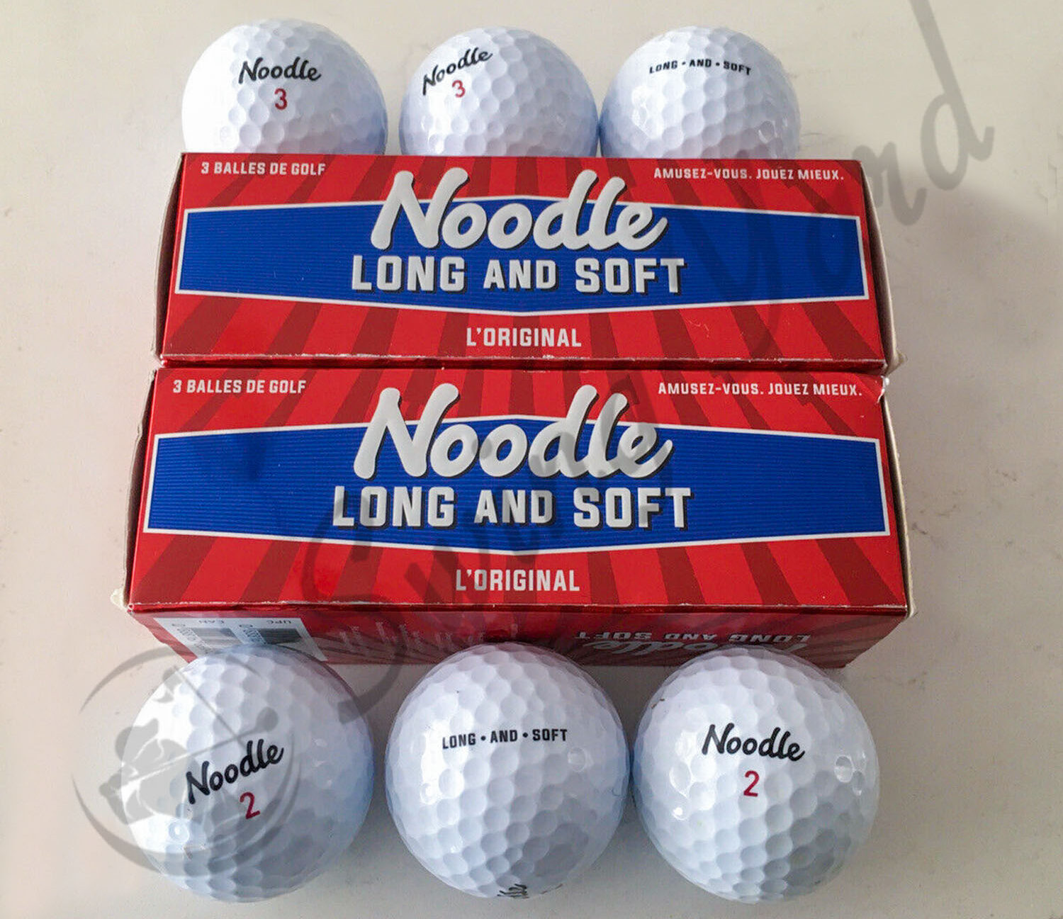 A TaylorMade Noodle Long and Soft golf ball box packaging at my house