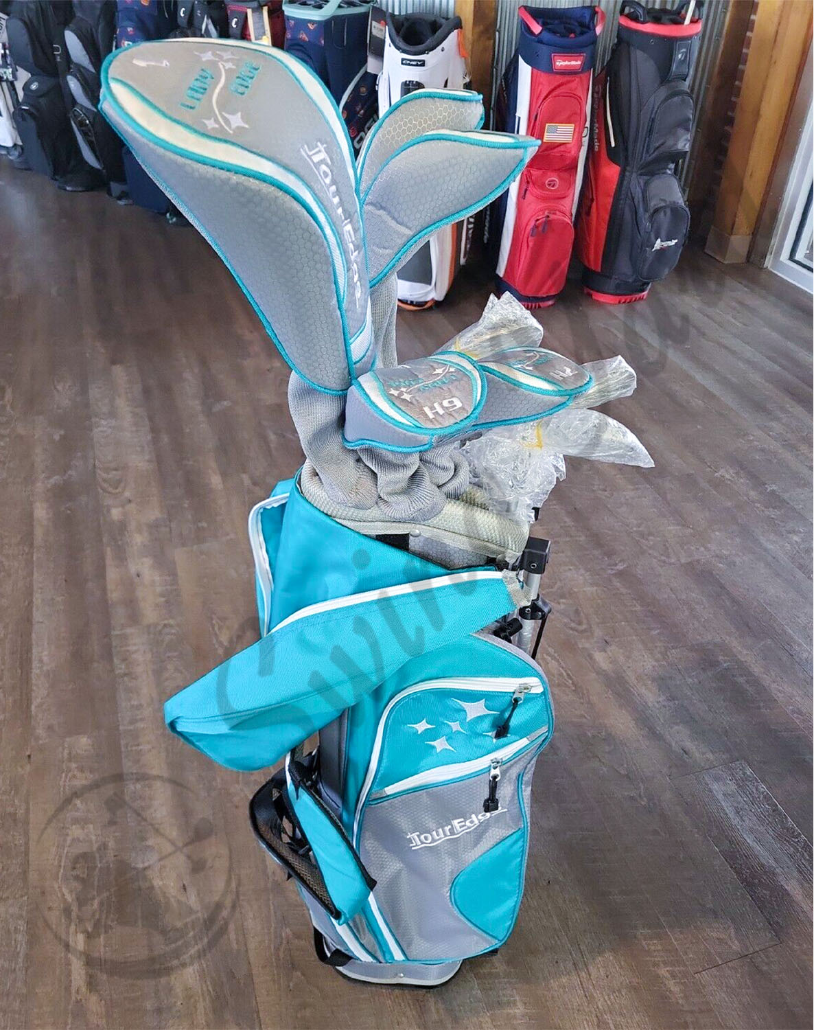 A set of Tour Edge Lady Edge with golf bag and headcover at the store