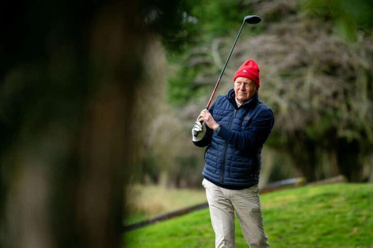Old golfer showcasing the best winter golf attire
