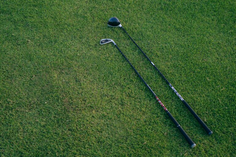 golf clubs and shafts in the grass