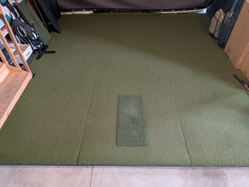 An image of my entire sigpro softy golf hitting strip and golf hitting mat setup in my garage
